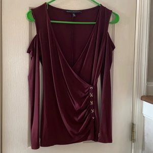 Burgundy cold shoulder top with grommet detail